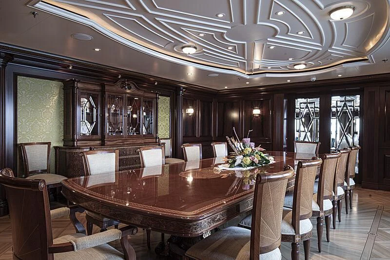 a large dining room with a table and chairs aboard FIREBIRD Yacht for Charter