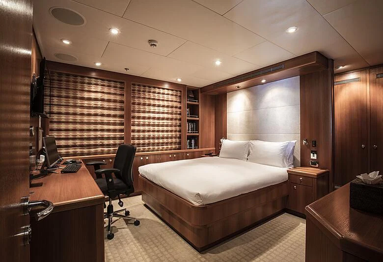 a bedroom with a large bed aboard FIREBIRD Yacht for Charter