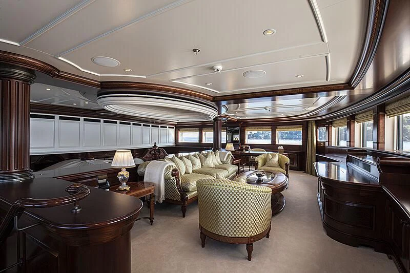 a large living room with a piano aboard FIREBIRD Yacht for Charter