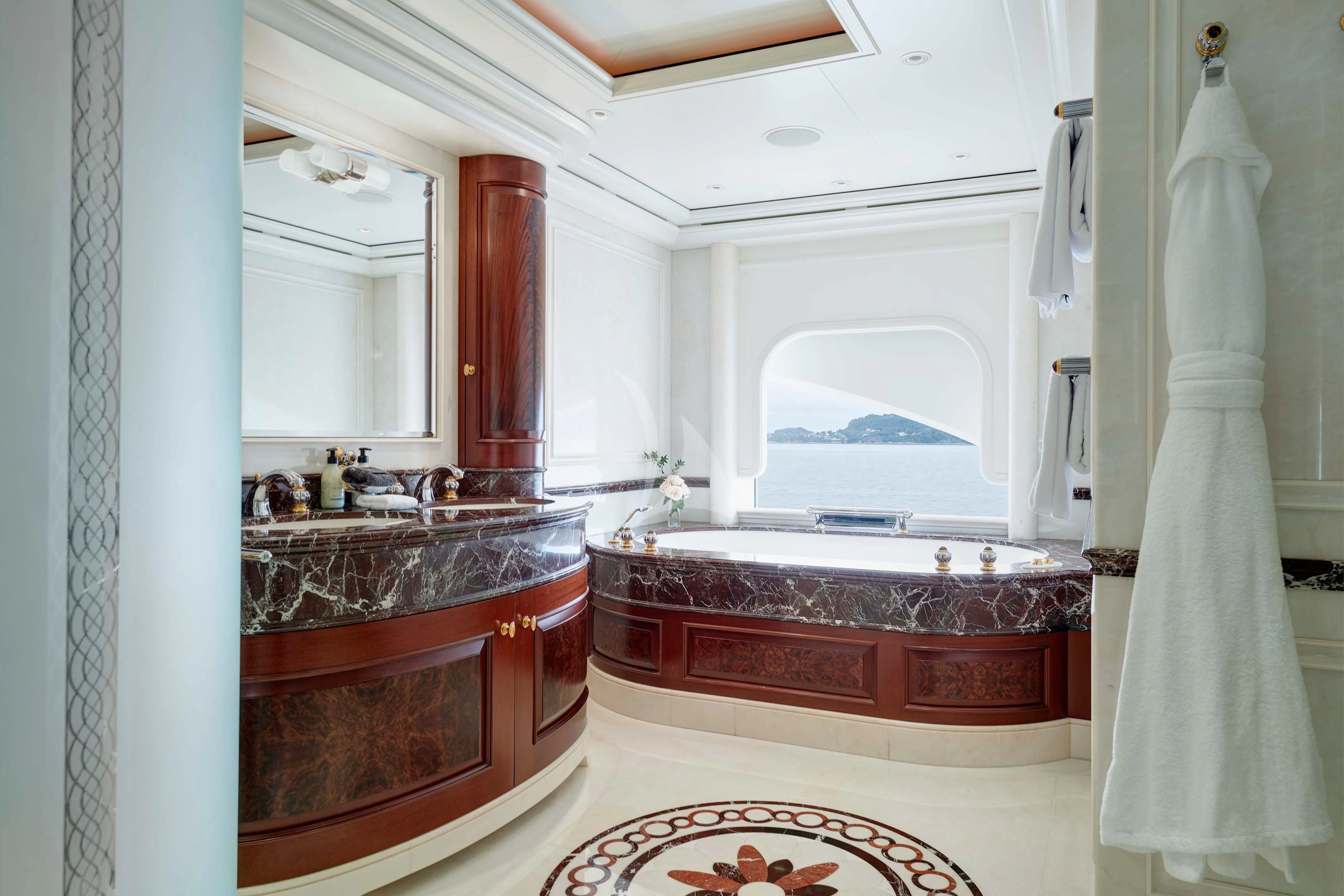 a bathroom with a large bathtub aboard FIREBIRD Yacht for Charter