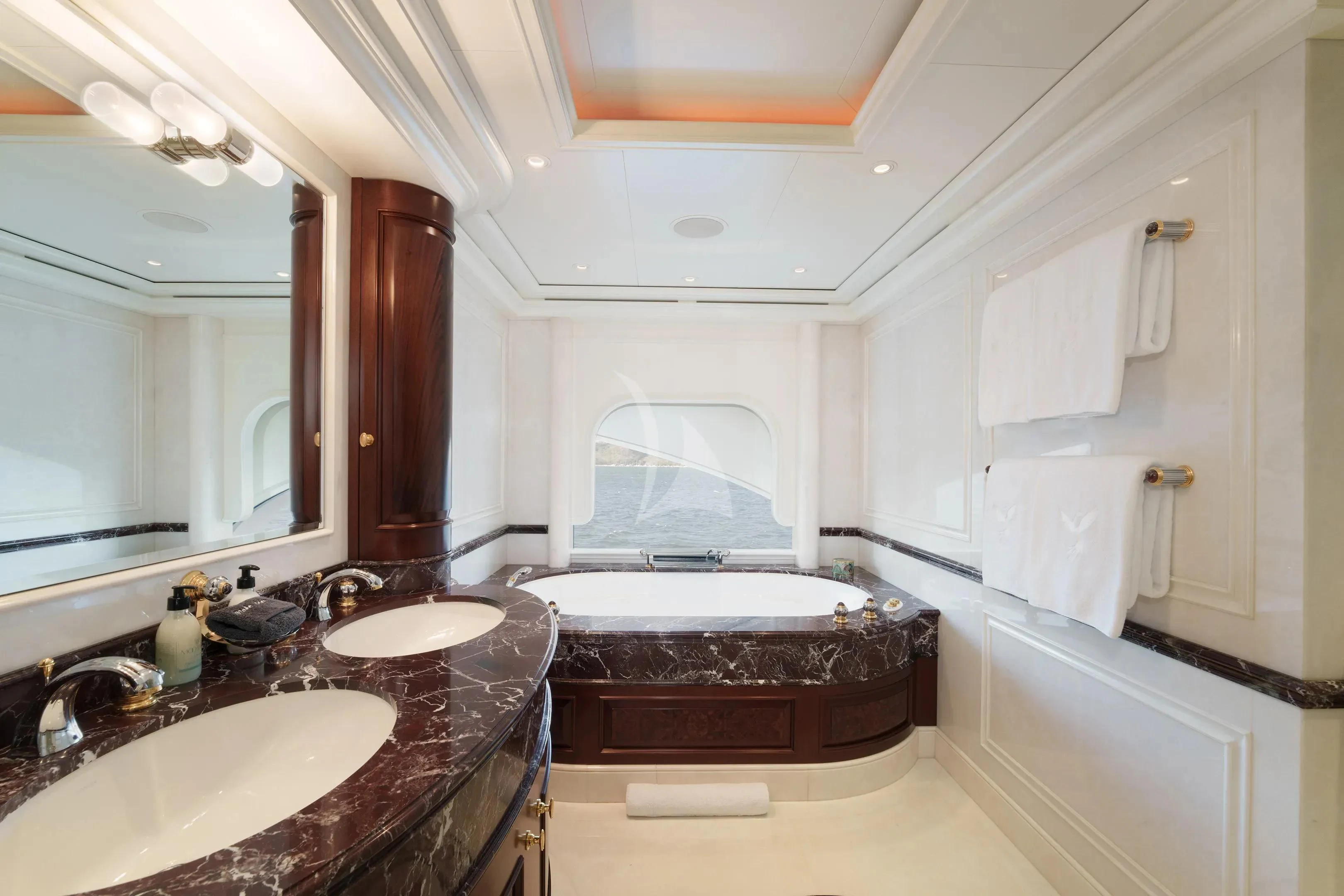 a bathroom with a large tub aboard FIREBIRD Yacht for Charter