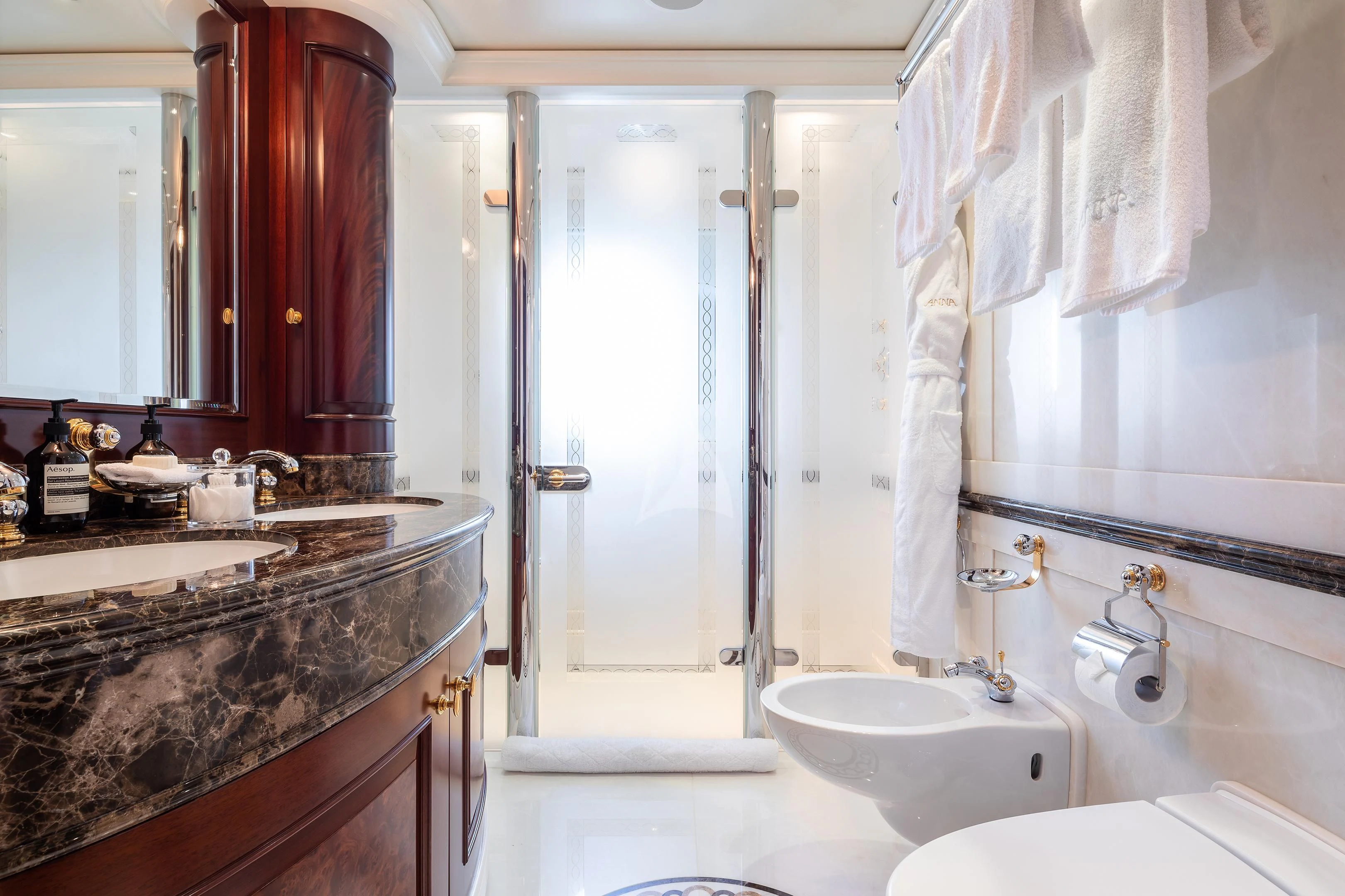 a bathroom with a sink and a mirror aboard FIREBIRD Yacht for Charter