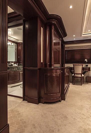 a large wooden cabinet in a room aboard FIREBIRD Yacht for Charter