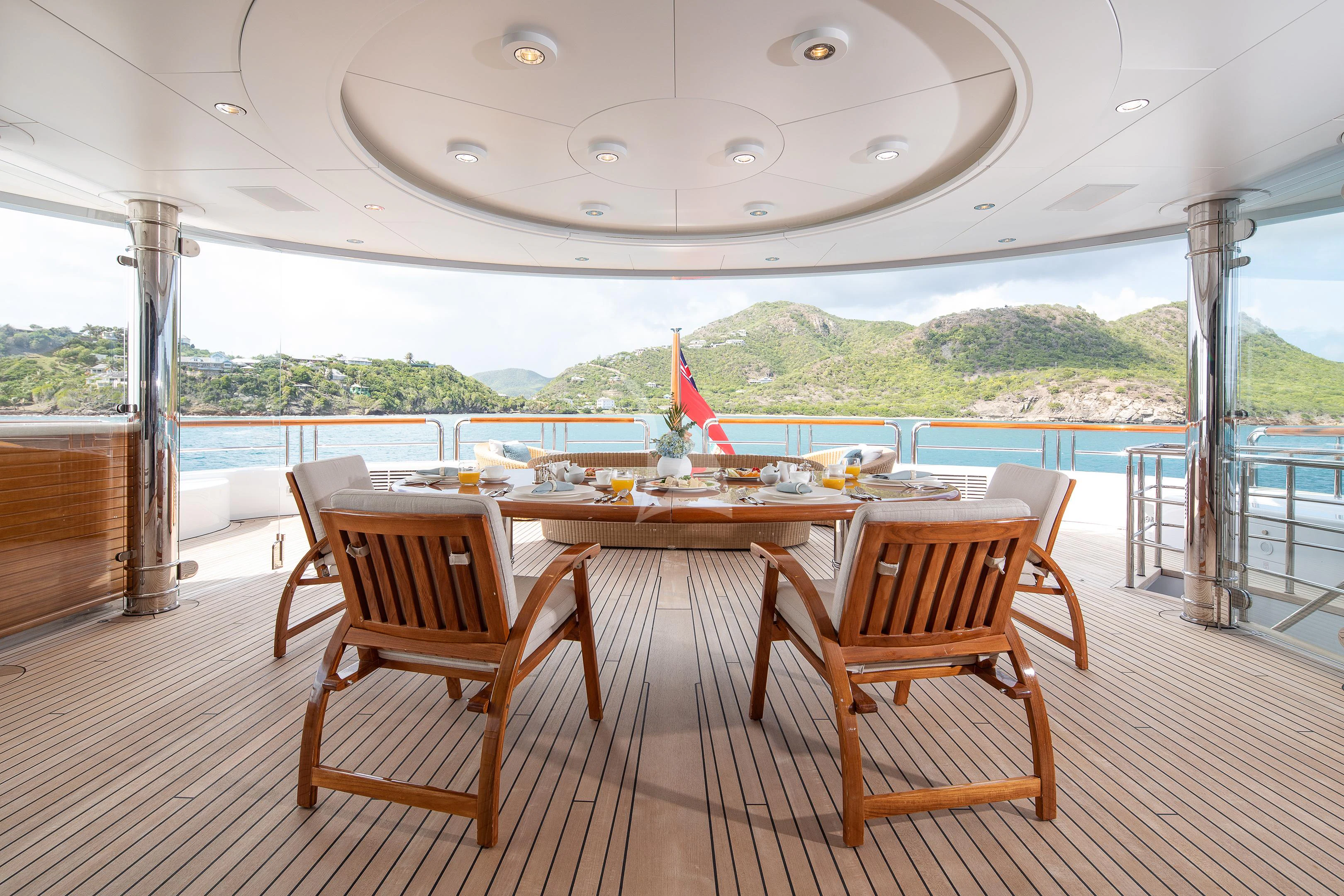 a room with a table and chairs aboard FIREBIRD Yacht for Charter