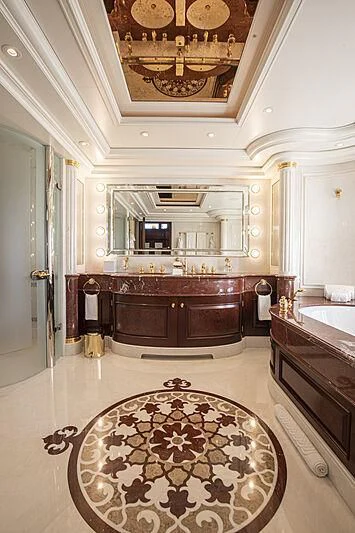 a bathroom with a large mirror aboard FIREBIRD Yacht for Charter