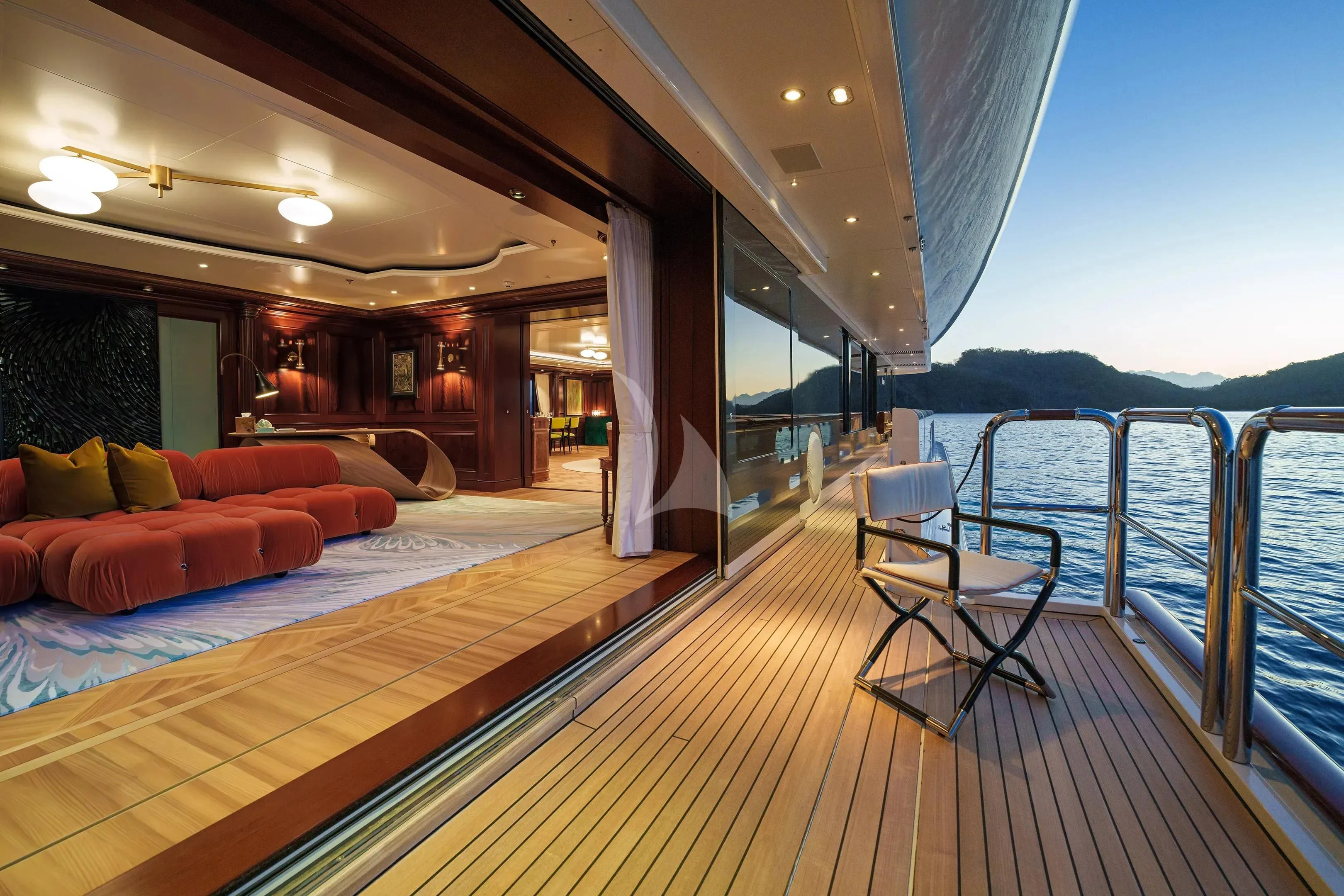 a large hotel room with a balcony aboard FIREBIRD Yacht for Charter