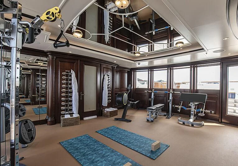 a room with a large gym aboard FIREBIRD Yacht for Charter