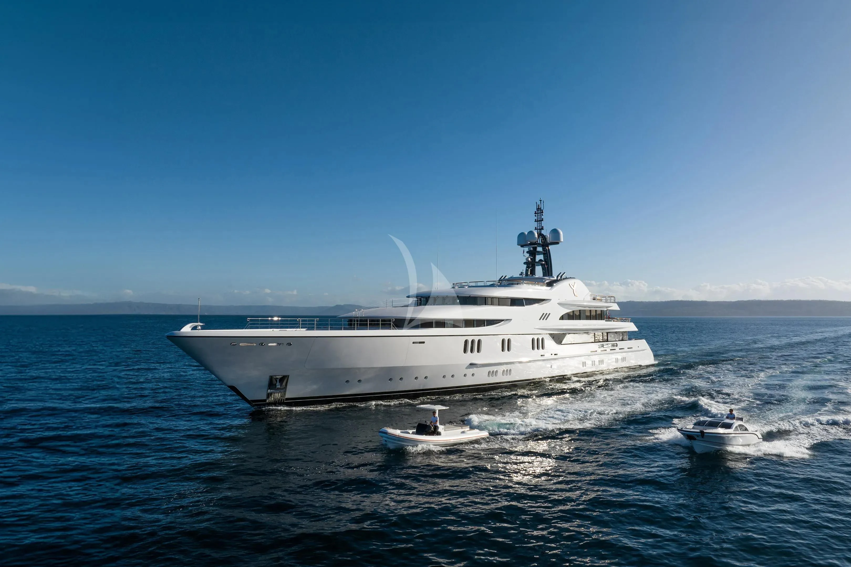 a large white ship on the water aboard FIREBIRD Yacht for Charter