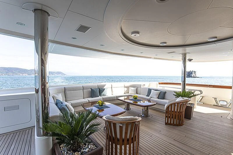 a living room with a large balcony aboard FIREBIRD Yacht for Charter