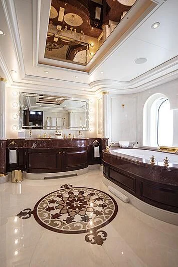 a bathroom with a large mirror aboard FIREBIRD Yacht for Charter