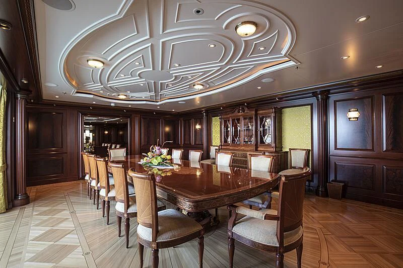 a dining room with a table and chairs aboard FIREBIRD Yacht for Charter