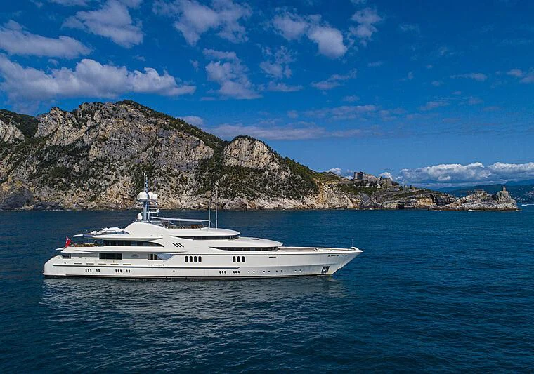 a white boat in the water aboard FIREBIRD Yacht for Charter