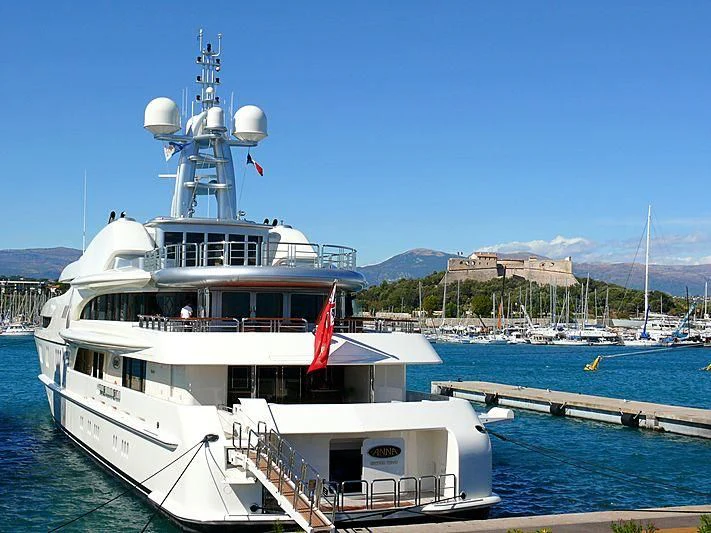a boat docked at a pier aboard FIREBIRD Yacht for Charter