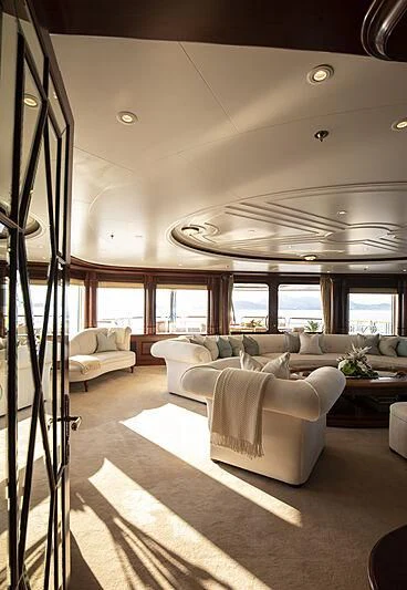 a living room with a large window aboard FIREBIRD Yacht for Charter