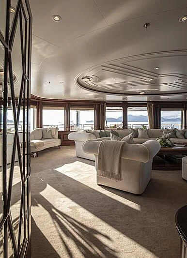a living room with a large window aboard FIREBIRD Yacht for Charter