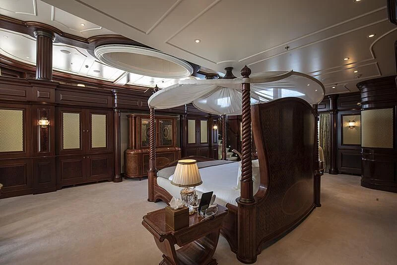 a large room with a large wood structure and a table aboard FIREBIRD Yacht for Charter