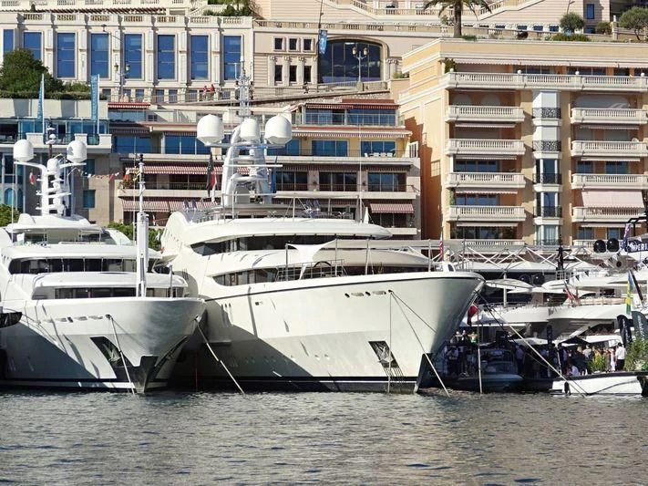 a group of boats are parked in the water aboard FIREBIRD Yacht for Charter