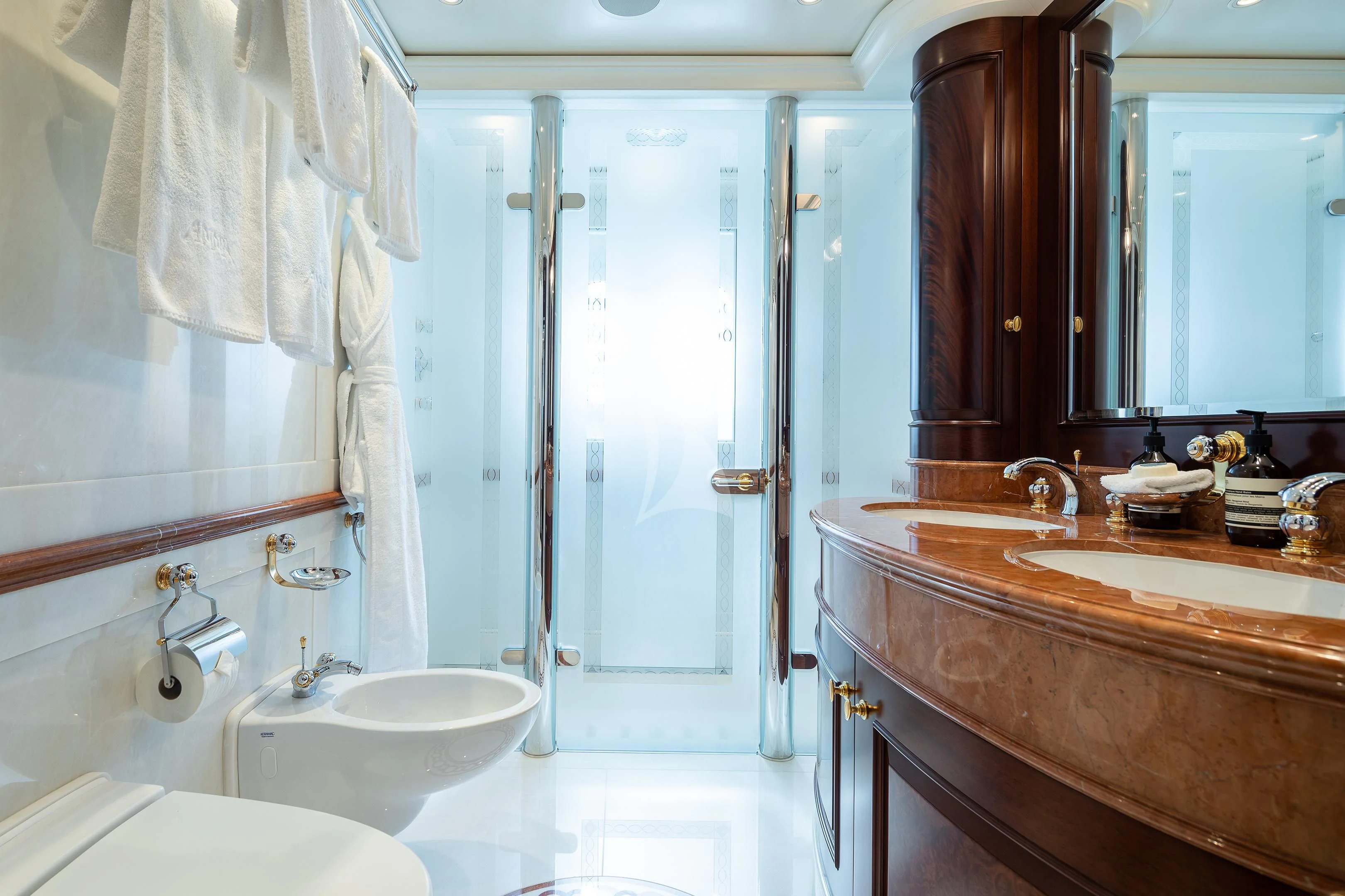 a bathroom with a sink and a bathtub aboard FIREBIRD Yacht for Charter