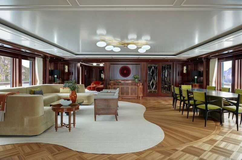 a living room with a large table and chairs aboard FIREBIRD Yacht for Charter