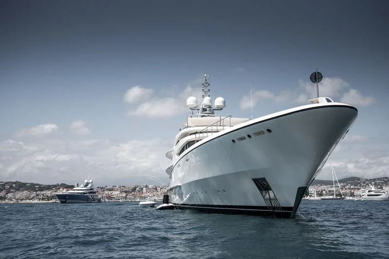 a large white ship in the water aboard FIREBIRD Yacht for Charter