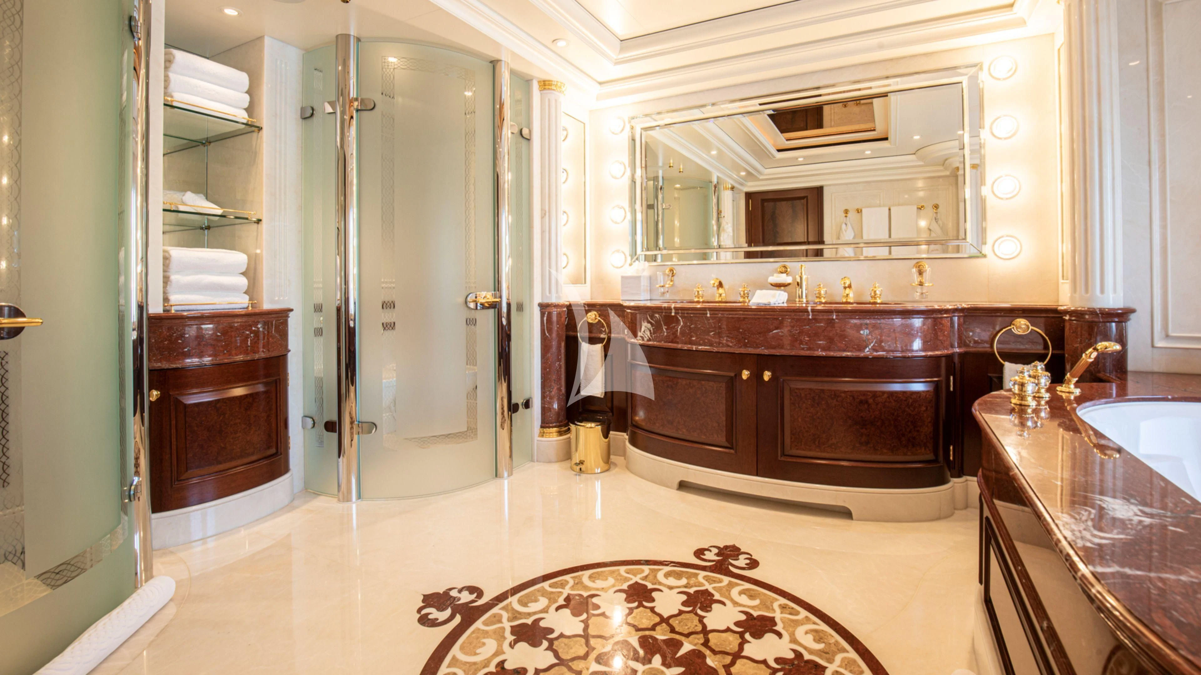 a bathroom with a large bathtub and a sink aboard FIREBIRD Yacht for Charter
