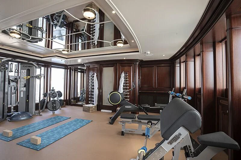 a gym with exercise equipment aboard FIREBIRD Yacht for Charter