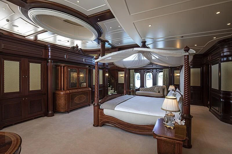 a bedroom with a canopy bed aboard FIREBIRD Yacht for Charter