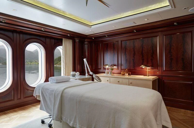 a room with a bed and a window aboard FIREBIRD Yacht for Charter