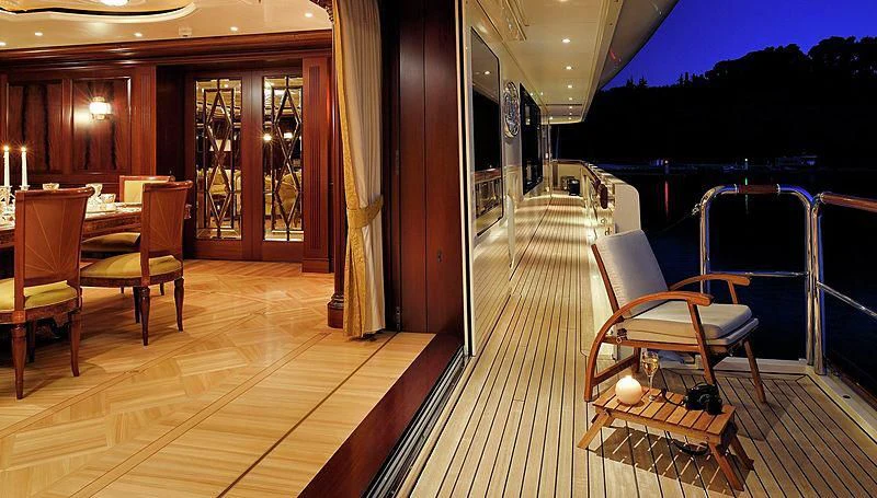 a room with chairs and tables aboard FIREBIRD Yacht for Charter