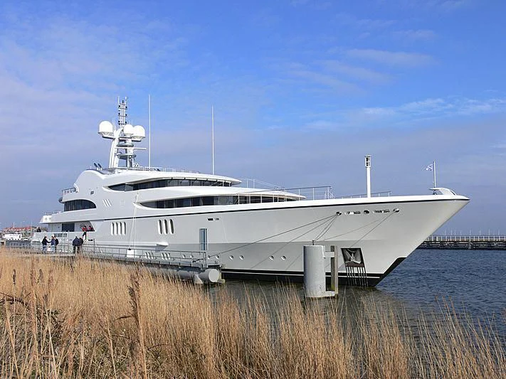 a large white boat in a body of water aboard FIREBIRD Yacht for Charter