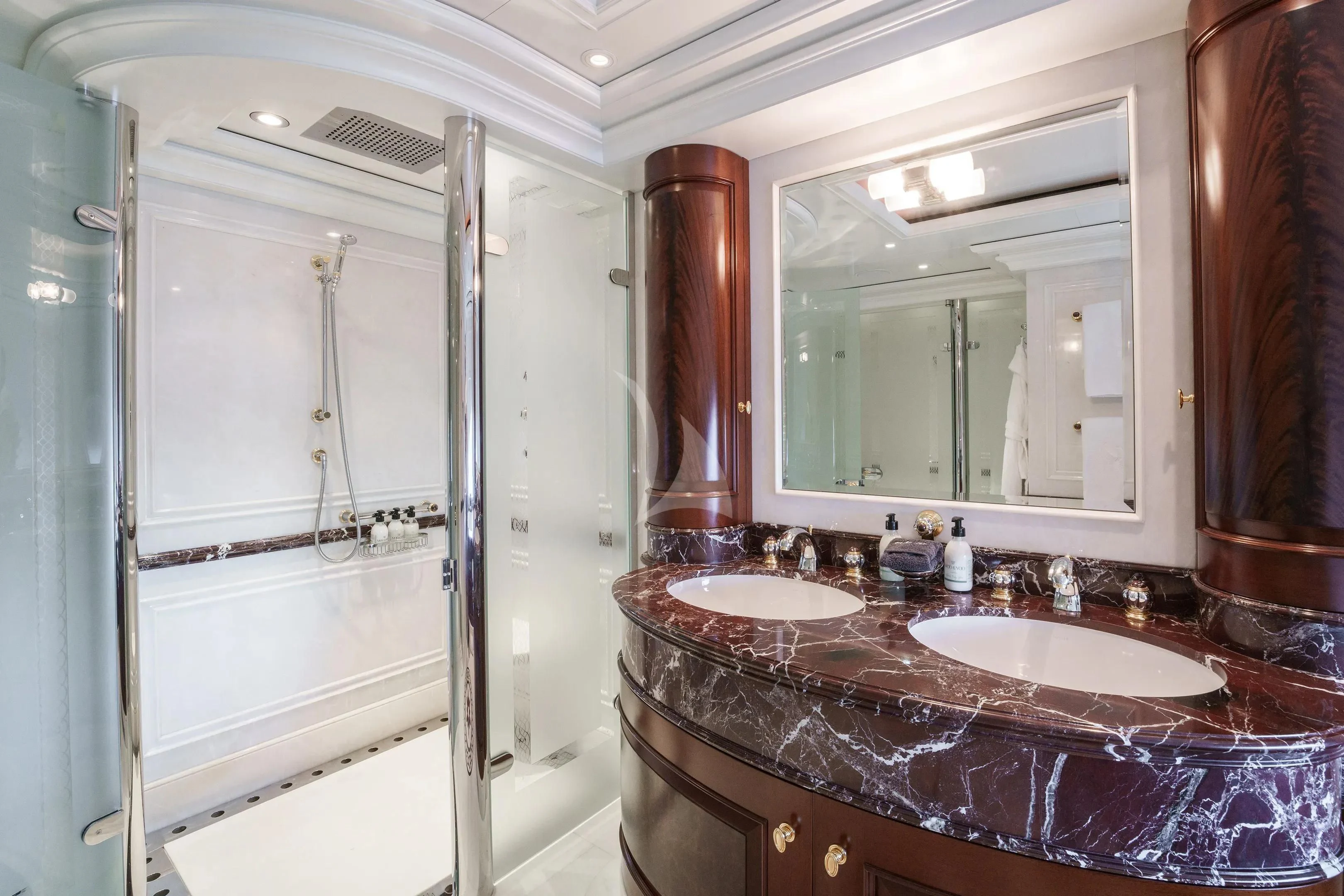 a bathroom with a marble countertop aboard FIREBIRD Yacht for Charter