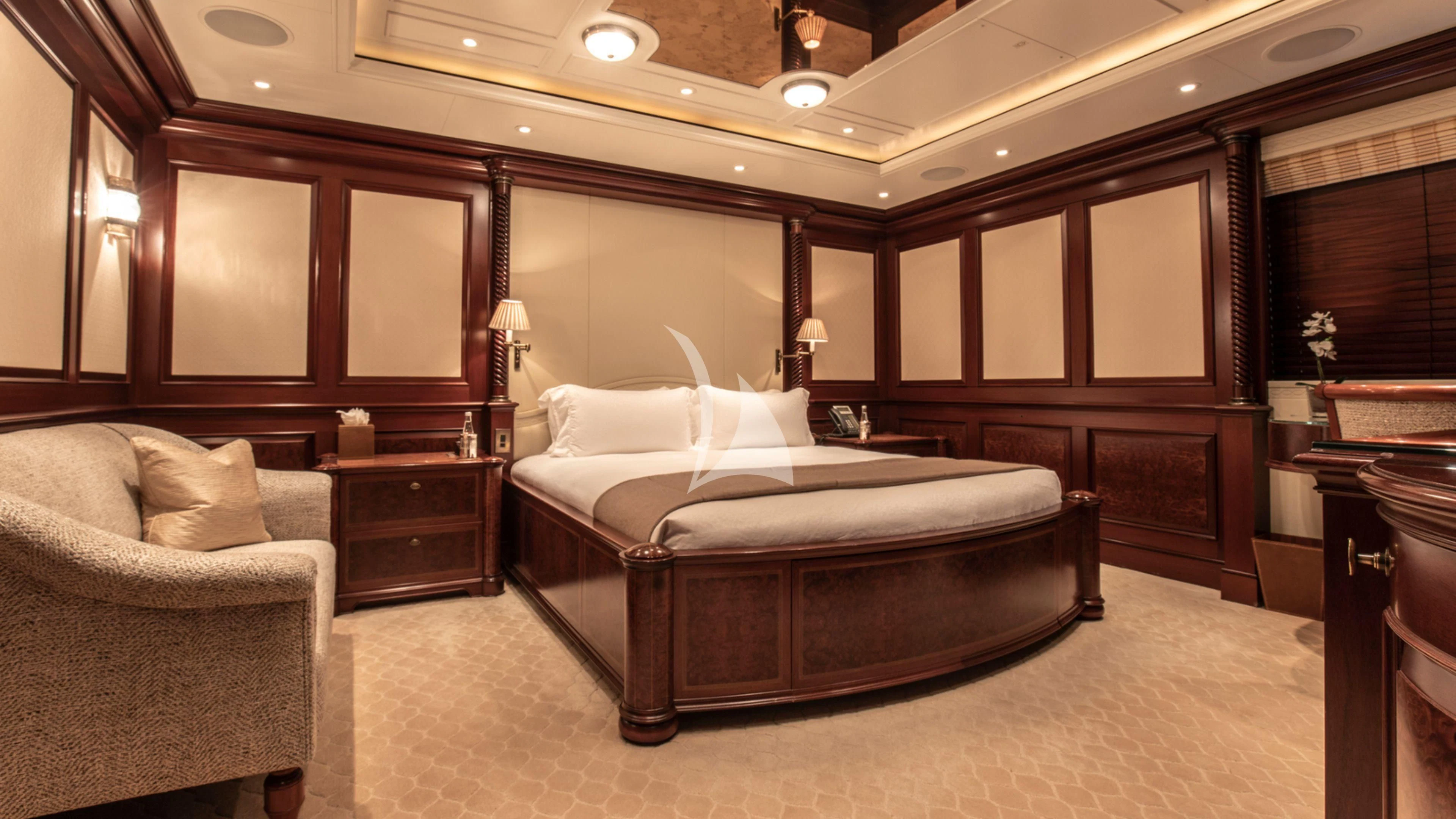a large bedroom with a bed aboard FIREBIRD Yacht for Charter