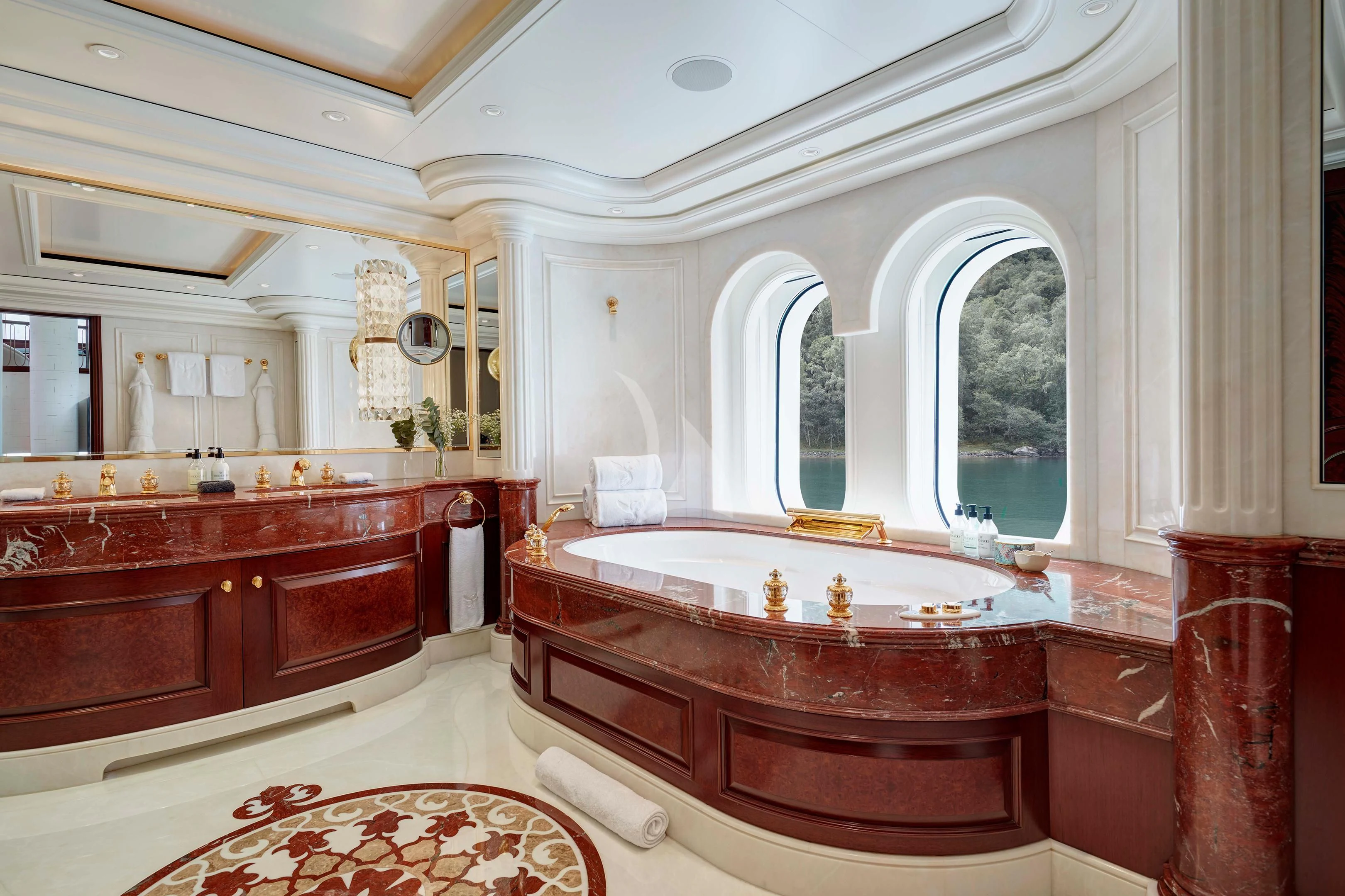 a bathroom with a bathtub and a sink aboard FIREBIRD Yacht for Charter