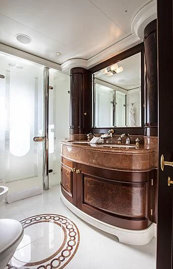 a bathroom with a large mirror aboard FIREBIRD Yacht for Charter