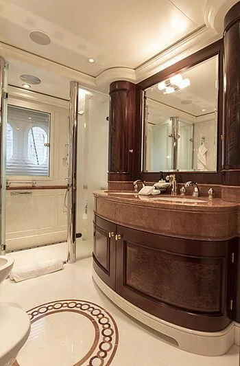 a bathroom with a large mirror aboard FIREBIRD Yacht for Charter