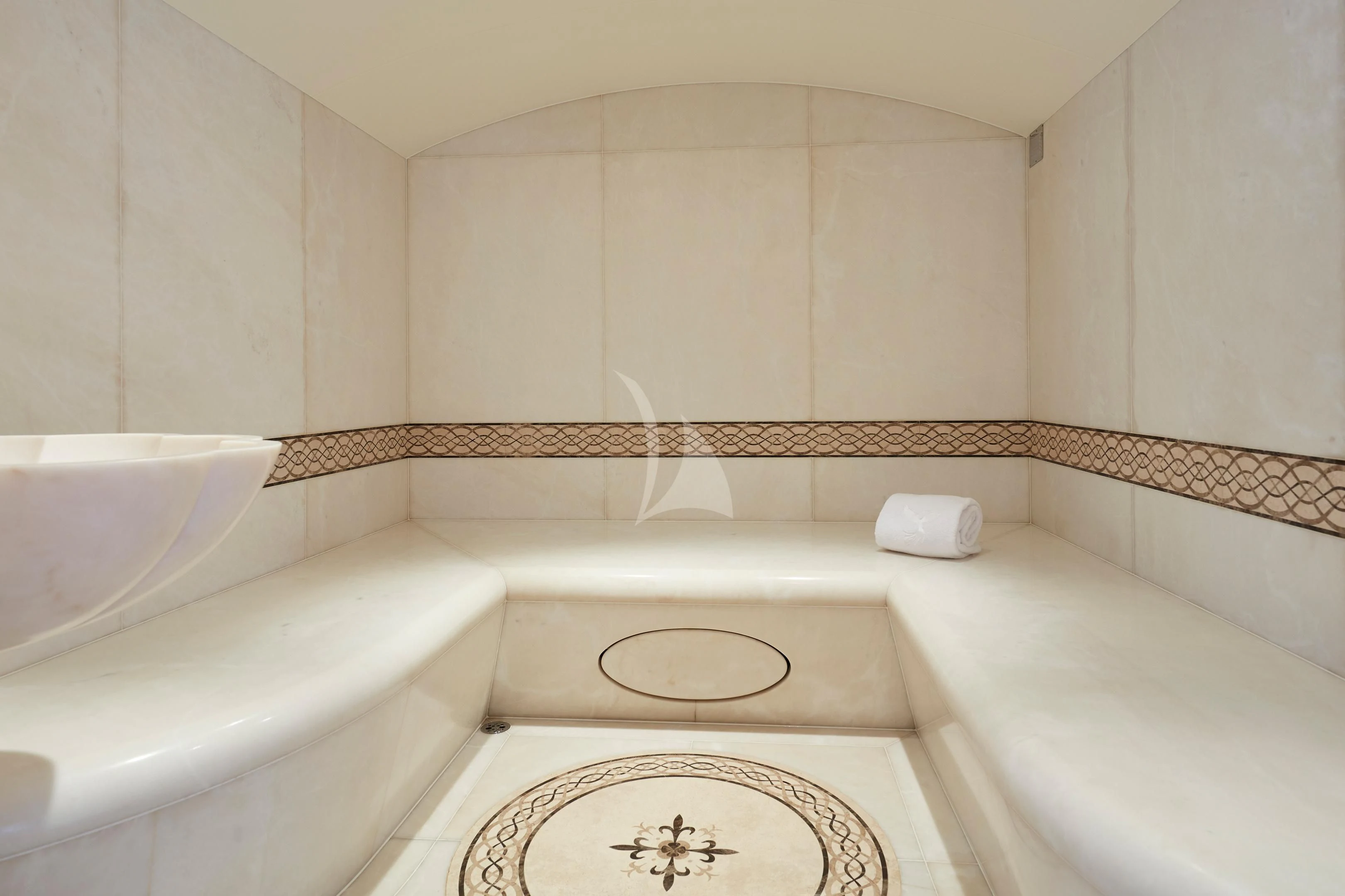 a bathroom with a tub sink and a rug aboard FIREBIRD Yacht for Charter