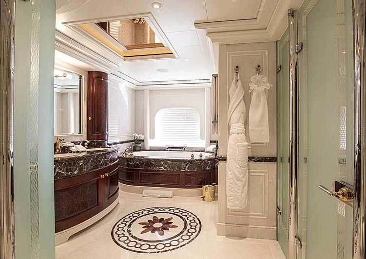 a bathroom with a marble statue aboard FIREBIRD Yacht for Charter