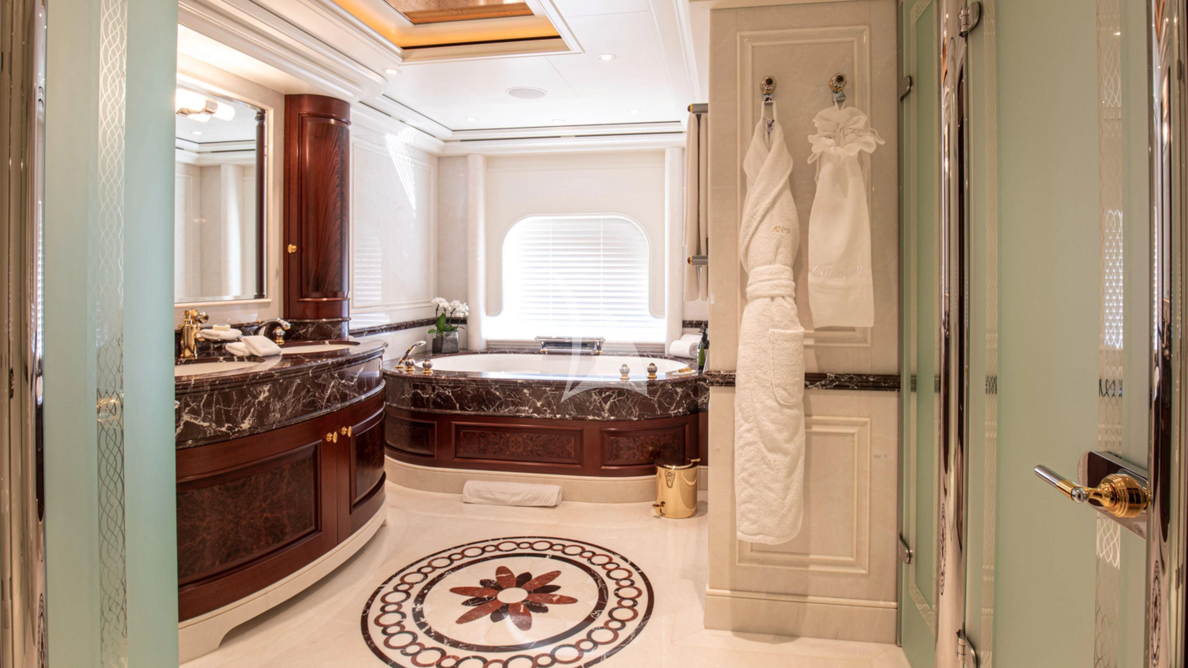 a bathroom with a large bathtub aboard FIREBIRD Yacht for Charter