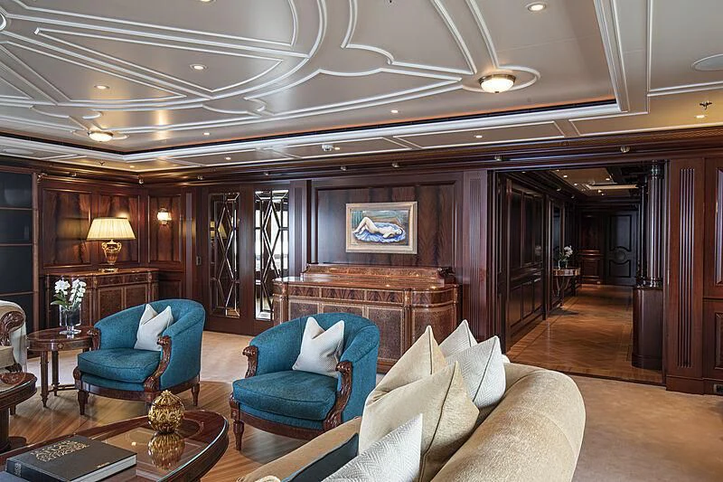 a large living room with a large mirror aboard FIREBIRD Yacht for Charter