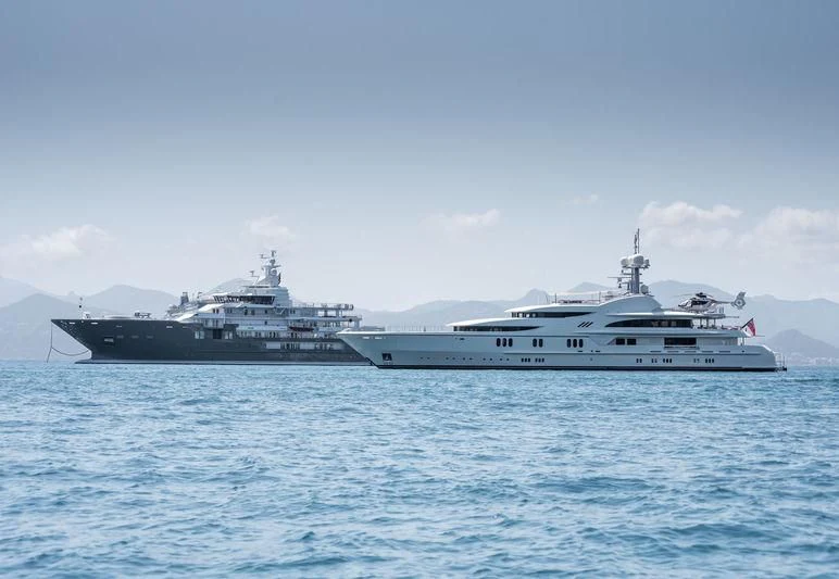 a couple of large ships in the water aboard FIREBIRD Yacht for Charter