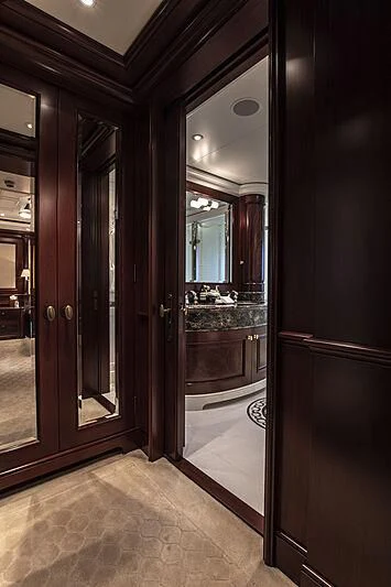 a bathroom with a large mirror aboard FIREBIRD Yacht for Charter