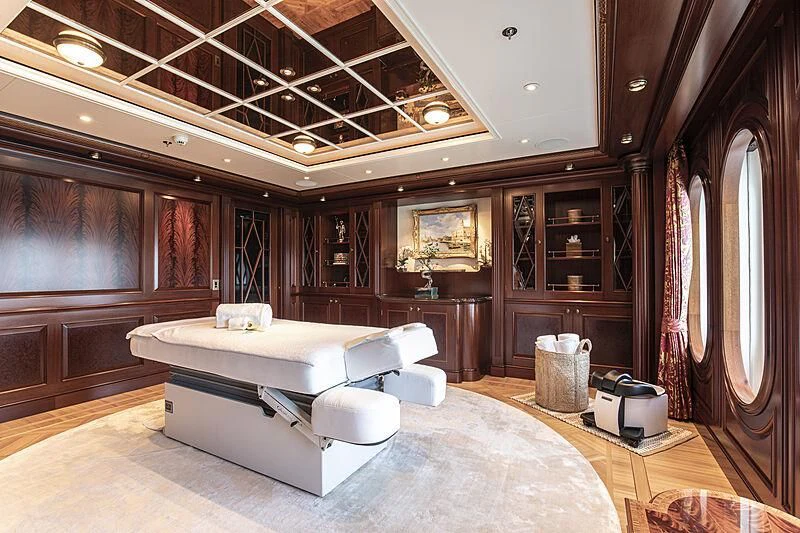 a large room with a couch and a table aboard FIREBIRD Yacht for Charter