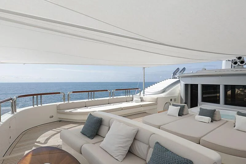 a large white boat on a body of water aboard FIREBIRD Yacht for Charter