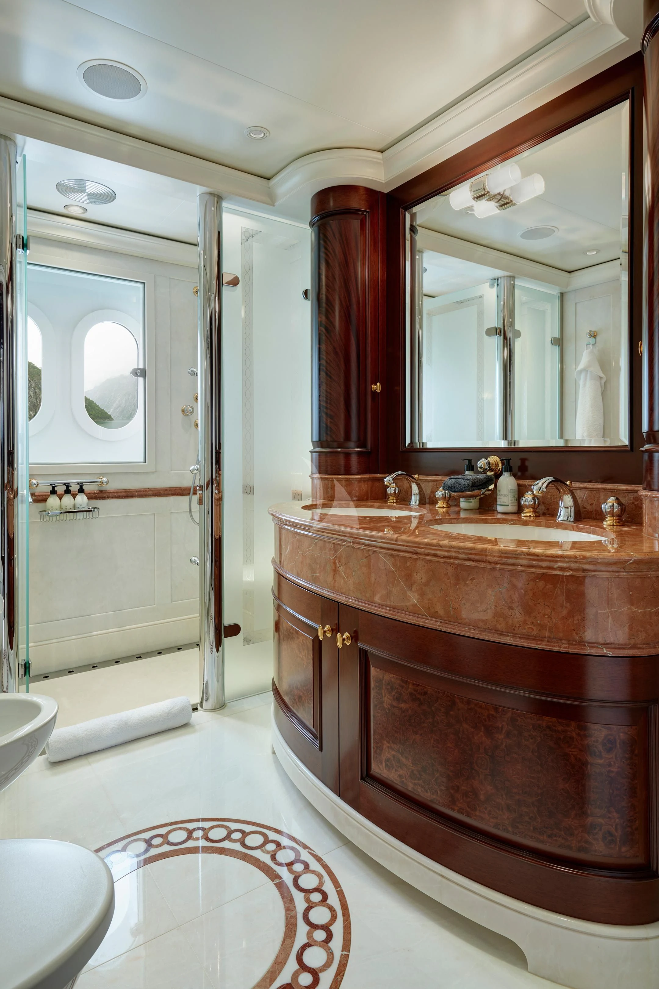 a bathroom with a large mirror aboard FIREBIRD Yacht for Charter