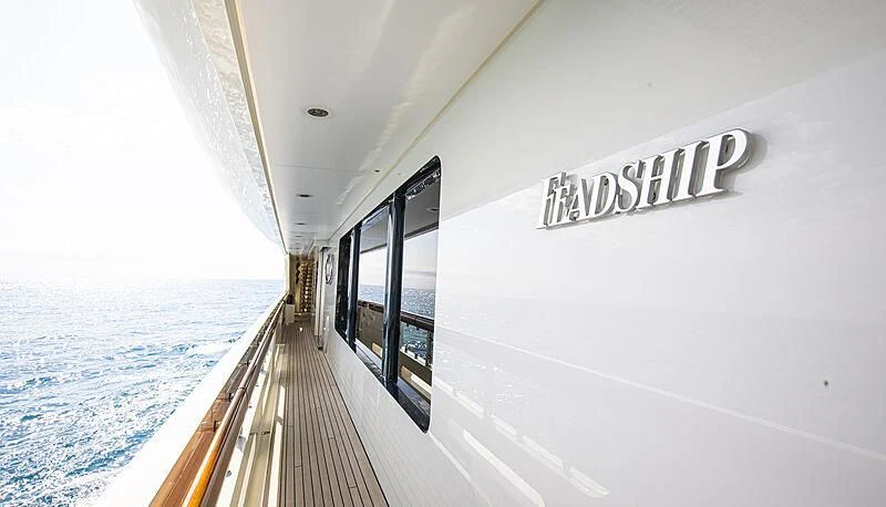 a white building with a balcony aboard FIREBIRD Yacht for Charter