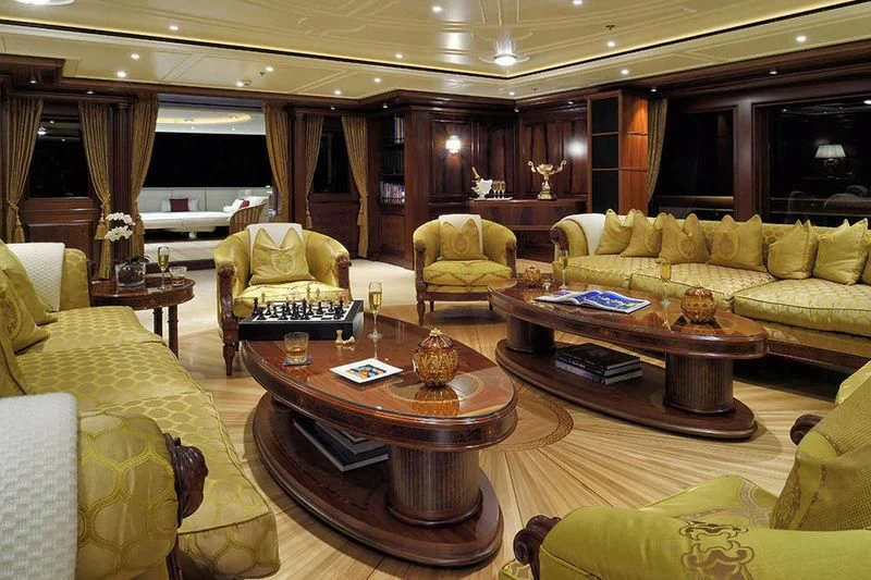a living room with a table and chairs aboard FIREBIRD Yacht for Charter
