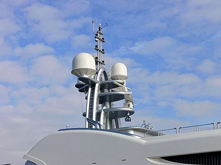 a white boat with a satellite dish on top aboard FIREBIRD Yacht for Charter