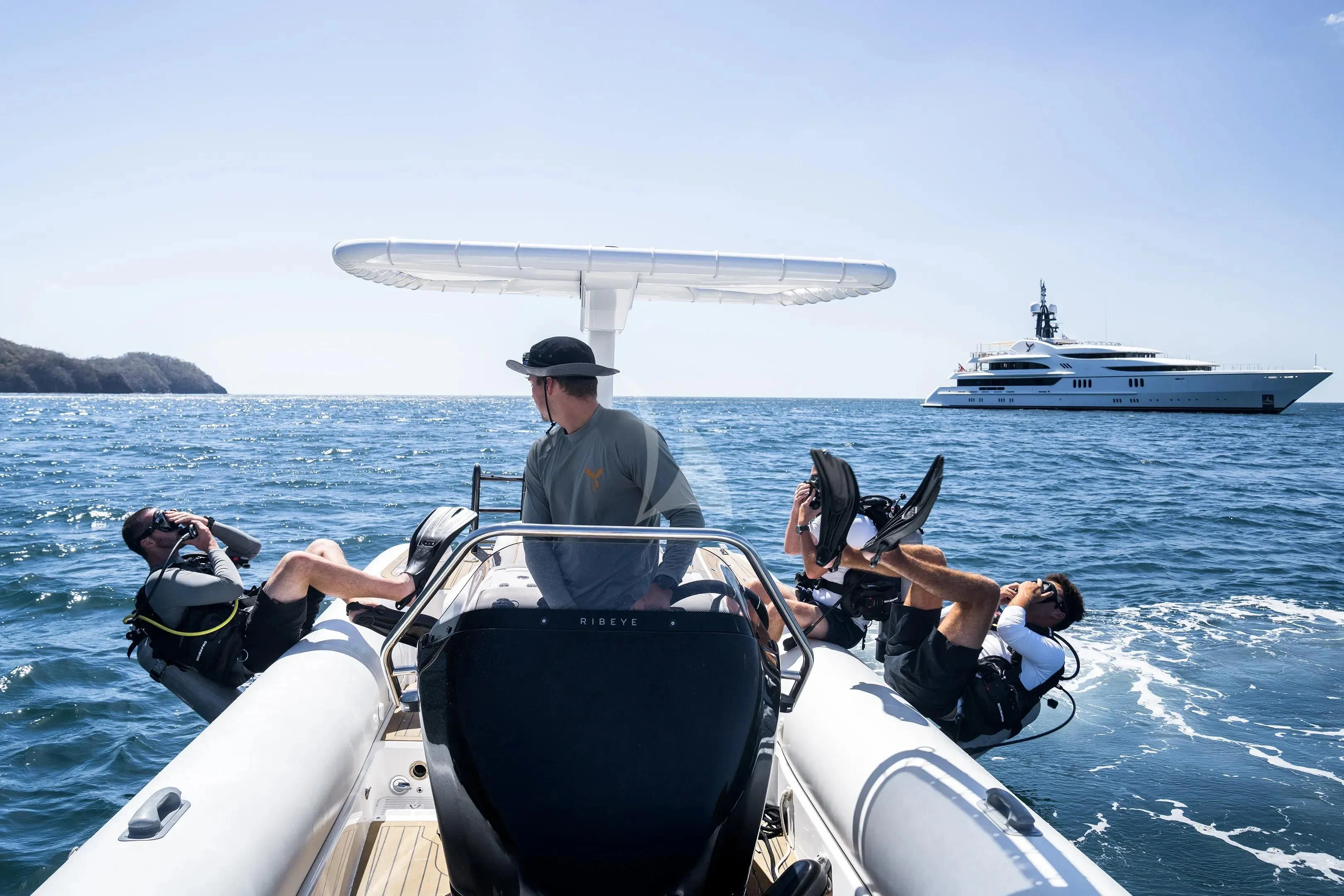 a group of people in a boat aboard FIREBIRD Yacht for Charter