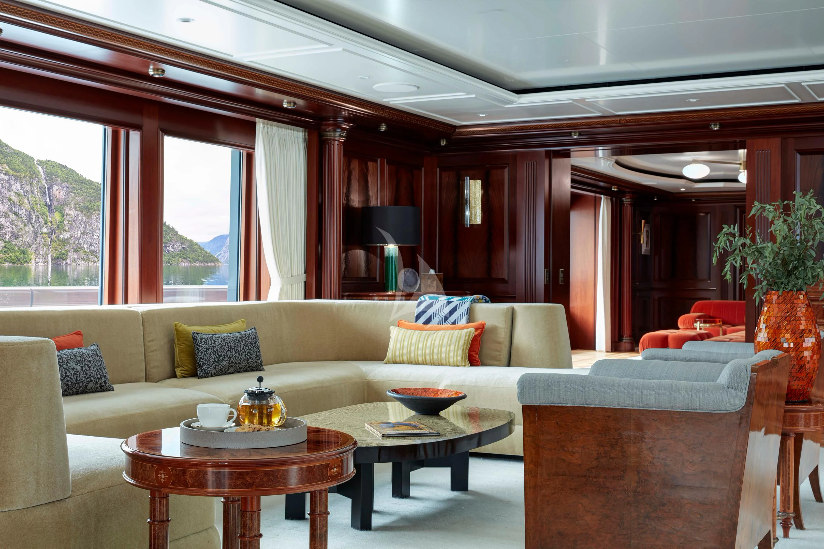 a living room with a couch and a table aboard FIREBIRD Yacht for Charter