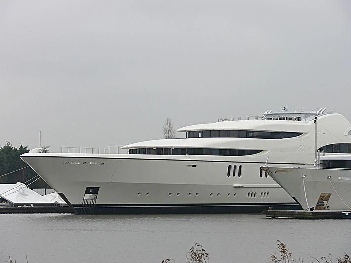 a large white boat in a body of water aboard FIREBIRD Yacht for Charter